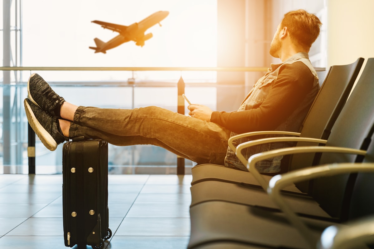 Traveler using a phone at the airport
